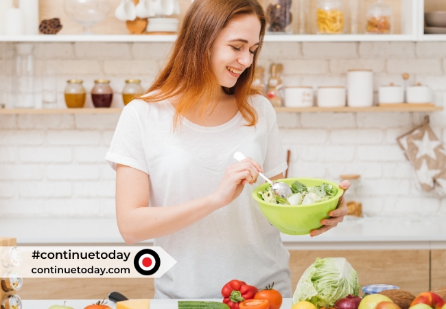 A girl is making salad
