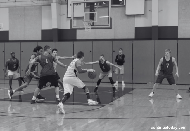 A group of collage student playing basketball