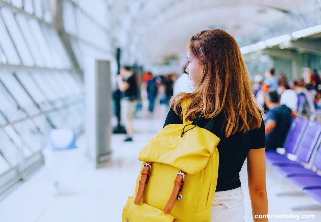 A girl is waiting at airport for international tour