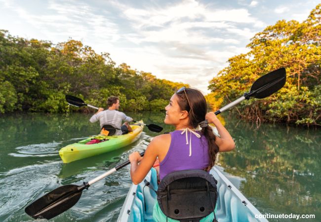 Two people are enjoying a domestic trip on river