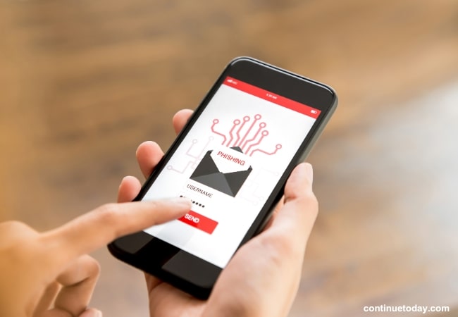 holding phishing sign on mobile screen 