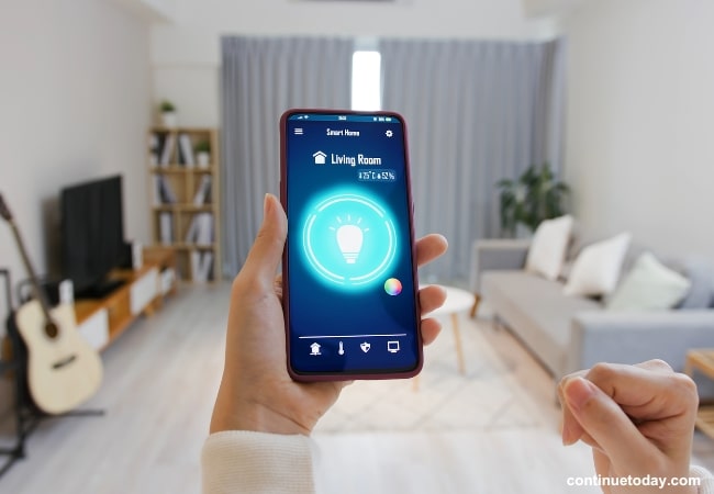 human hand holding a phone with Connectivity Without A Hub in IoT