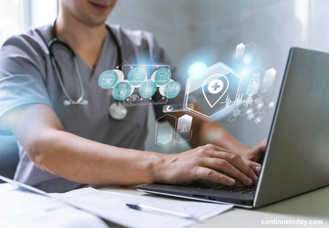 doctor operating laptop for medical purpose with cloud computing