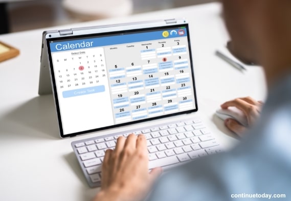 human hand developing NFT calendar on laptop to Promote NFT Collection   
